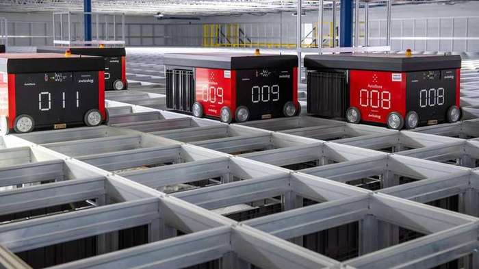 Swisslog AutoStore robots operating in warehouse grid